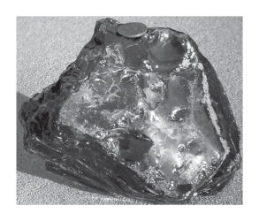 Obsidian,shown below,____________.   A) is volcanic glass B) possesses conchoidal fracture C) typically is felsic in composition D) All of the above are correct.