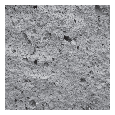 A volcano emits ash,which falls from the sky,settles in layers,and is eventually cemented.The resulting rock is termed ____________.   A) pumice B) granite C) tuff D) ignimbrite