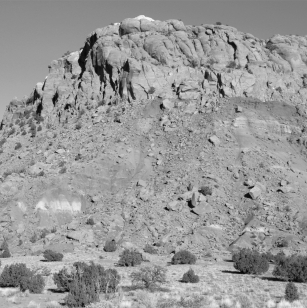 What type of weathering has happened to the rocks in the picture?   A)  hydrolysis B)  hydration C)  dissolution D)  oxidation