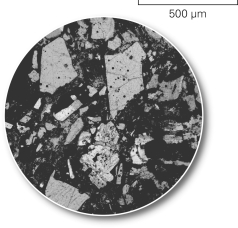 The picture below shows a(n) ______________ of rock which geologists use to determine the minerals in the rock.   A)  hand sample B)  thin section C)  outcrop D)  X-ray
