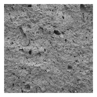 A volcano emits ash,which falls from the sky,settles in layers,and is eventually cemented.The resulting rock is termed ____________.   A)  pumice B)  granite C)  tuff D)  ignimbrite