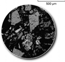 The picture below shows a(n) ________ of rock that geologists use to determine the minerals in the rock.   A) hand sample B) thin section C) outcrop D) X-ray