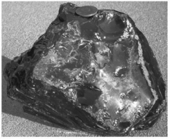 Which of the following is NOT a characteristic of the extrusive igneous rock obsidian?   A) It is composed of volcanic glass. B) It possesses conchoidal fracture. C) It is typically felsic in composition. D) It likely cooled very slowly.