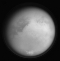 Where does Titan's thick,nitrogen-rich atmosphere (see the image below) come from?   A)  photodissociation of methane in its atmosphere B)  frequent volcanic eruptions C)  cometary impacts over the age of the Solar System D)  photosynthesis of algae in oceans that lie beneath its icy surface