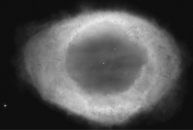 The Ring Nebula (image below) is a planetary nebula that currently has a radius of 0.4 pc and an expansion velocity of 250 km/s.Approximately how long ago did its parent star die and eject its outer layers?   A)  1,600 years ago B)  3,200 years ago C)  5,400 years ago D)  28,000 years ago
