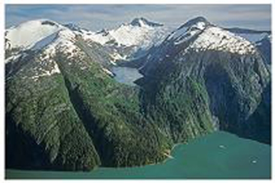 What name best describes the area of the lake in this photograph?   A) terminal moraine B) equilibrium line C) fjord D) lateral moraine E) drumlin