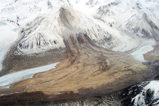 The main feature shown in this photograph illustrates   A) weathering. B) flooding. C) permafrost. D) slope failure.
