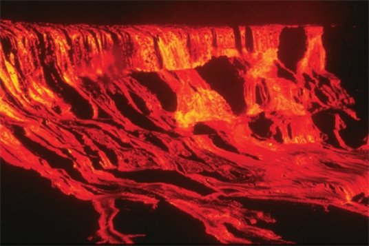 Long, thin lava flows are typically produced by   A) volatile-rich eruptions. B) high-viscosity lavas. C) low-viscosity lavas. D) collapsing eruption columns.