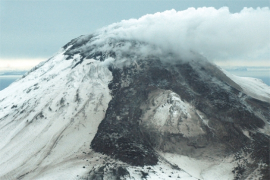 What types of rocks would be most common in the volcano in this photograph?   A) scoria and other vesicular basalt B) basalt mostly formed in lava flows C) felsic and intermediate lava flows D) pillow basalts E) None of these.