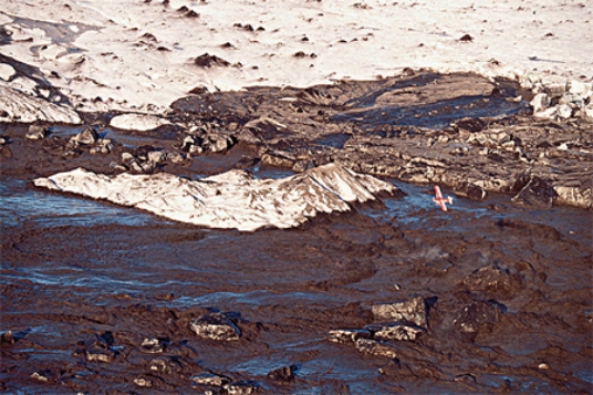 Volcanic eruptions can produce huge floods by   A) melting ice sheets. B) erupting huge quantities of water vapor. C) displacing water in lakes.