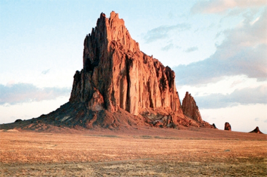 The igneous feature shown in this photograph is   A) dike. B) sill. C) volcanic neck. D) batholith.