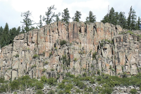 What type of structure is expressed in this cliff face?   A) normal faults B) reverse faults C) joints D) folds