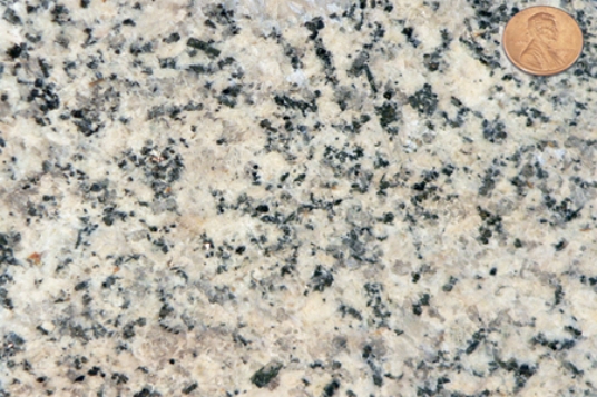 Which of the following rock photographs depicts a felsic igneous rock? A)    B)    C)    D)   