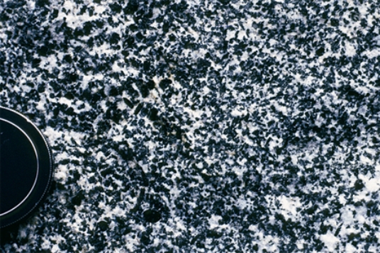 Which of the following rock photographs depicts a felsic igneous rock? A)    B)    C)    D)   