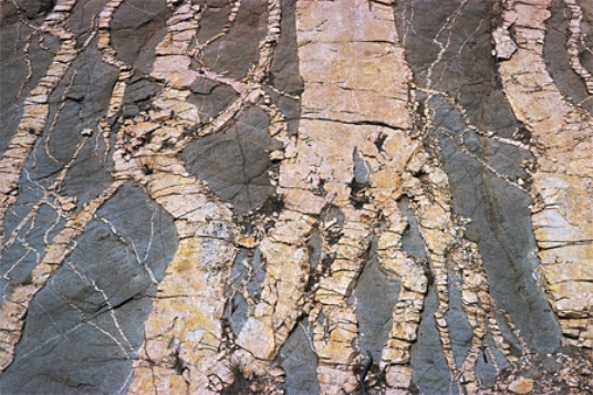 The principle that can be used to determine that the rocks shown in the photograph have not been deformed since they were deposited is the principle of   A) original horizontality. B) superposition. C) cross-cutting relations.