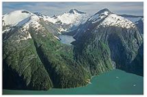 What name best describes the area of the lake in this photograph?   A) Terminal moraine B) Equilibrium line C) Fjord D) Lateral moraine E) Drumlin