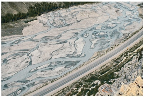 What type of stream is shown in this photograph?   A) Meandering stream B) Braided stream C) A stream whose main channel has high sinuosity D) An esker
