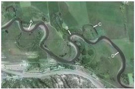 Which of the features on this aerial photograph is an oxbow lake?   A) A B) B C) C D) D
