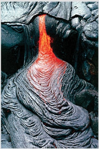 What type of basaltic feature is shown in this photograph?   A) Vesicles B) Volcanic bomb C) Aa lava flow D) Pahoehoe lava flow E) Pyroclastic flow