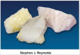 The very common mineral shown in this photograph is light colored,transparent,and fractures rather than cleaves.What mineral is it?   A) Garnet B) Quartz C) Biotite D) Muscovite E) Feldspar