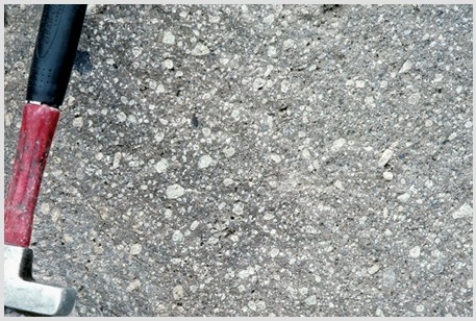 Which of the following rock photographs depicts a felsic igneous rock? A)    B)    C)    D)   