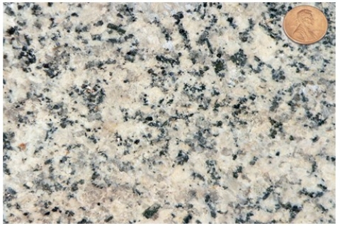 Which of the following rock photographs depicts an igneous rock that trapped gas? A)    B)    C)    D)   