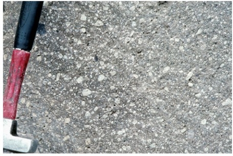 Which of the following rock photographs depicts an igneous rock that trapped gas? A)    B)    C)    D)   