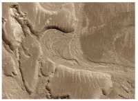 What does this curved feature,which contains a point bar,indicate about past events on Mars?   A) there were explosive volcanic eruptions B) strong winds eroded into a series of volcanic layers C) the surface once had running water that eroded and deposited sediment D) glaciers once covered the entire planet