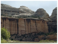 What desert feature is shown in this photograph?   A) alluvial fan B) playa C) caliche D) desert wash E) natural stain