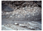 This photograph shows an upper unit with fragments and a lower unit with tilted layers.Which of the following statements is true?   A) the upper unit is younger because it is on top B) the upper unit is younger because it contains pieces of the underlying unit C) the lower unit is older because it was tilted and eroded before deposition of the upper unit D) all of these