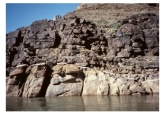 In this photograph,Paleozoic sandstone rests depositionally on Precambrian granite.What events must have occurred before deposition of the sandstone?   A) uplift of granite to the surface B) solidification of granite at depth C) formation of an erosion surface D) all of these E) none of these