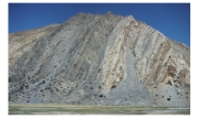 What type of deformation is shown in this photograph?   A) displacement B) rotation C) internal strain of the rock D) columnar joints