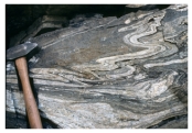 Under what conditions was this rock likely deformed?   A) relatively shallow B) brittle conditions C) conditions that favored fracturing D) hot and deep conditions