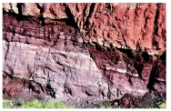 What type of structure is shown in this photograph?   A) joint B) cleavage C) fault D) anticline E) syncline