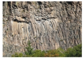 What type of feature is shown in this photograph?   A) fault scarp B) columnar joints C) shear zone D) folded metamorphic rocks