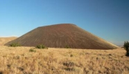 What type of eruption formed the small volcano in this photograph?   A) fluid lava flows B) eruption of viscous lava C) lava fountain D) eruption column E) pyroclastic flow