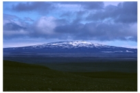 What is a main hazard of this type of volcano?   A) hot fragments thrown a short distance from the volcano B) burning,building collapse,and suffocation from widely distributed pyroclastic material C) destruction by moderately fluid lava flows that can flow far from the volcano D) volcanic mudflows and landslides E) relatively small pyroclastic eruptions caused by localized explosions or collapse