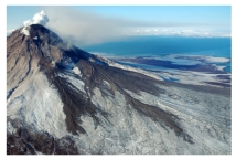 What types of rocks would be most common in the volcano in this photograph?   A) scoria and other vesicular basalt B) basalt mostly formed in lava flows C) felsic and intermediate lava flows and tephra D) pillow basalts E) none of these
