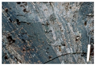 What type of eruption formed this flow-banded obsidian?   A) a viscous lava flow B) a pyroclastic column C) a pyroclastic flow D) a lava that broke apart while it flowed E) a lava fountain