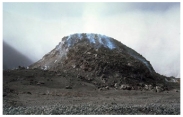 What types of rocks would be most common in the volcano in this photograph?   A) scoria and other vesicular basalt B) basalt mostly formed in lava flows C) felsic and intermediate lava flows D) pillow basalts E) none of these