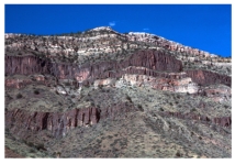 The dark igneous features shown in this photograph are:   A) dikes B) sills C) volcanic necks D) batholiths