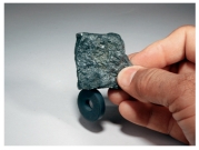 What mineral test is shown in this photograph?   A) scratch test B) effervescence C) streak D) magnetism E) specific gravity