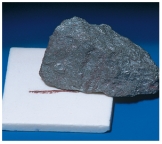 What mineral test is shown in this photograph?   A) scratch test B) effervescence C) streak D) magnetism E) specific gravity