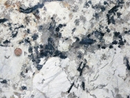 What type of rock is shown in this photograph?   A)  crystalline rock B)  clastic rock C)  rock with minerals that are too small to see D)  none of these