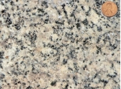 Which of the following rock photographs depicts a felsic igneous rock? A)    B)    C)    D)   
