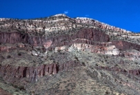 The dark igneous features shown in this photograph are:   A)  dikes B)  sills C)  volcanic necks D)  batholiths