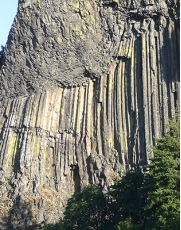 The igneous rocks shown in this photograph are forming:   A)  a dike B)  an irregular pluton C)  a volcanic neck D)  columnar joints