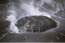 <strong>Comparing these two photographs, which eruption has lower viscosity magma?    </strong> A) the fluid cascade of lava B) the circular volcanic feature C) they could have the same viscosity D) there is no way to tell <div style=padding-top: 35px> 