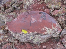 What type of basaltic feature is shown in this photograph?   A)  vesicles B)  volcanic bomb C)  aa lava flow D)  pahoehoe lava flow E)  pyroclastic flow