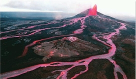 Shield volcanoes are built up primarily by relatively:   A)  nonexplosive outpourings of lava B)  explosive ash-forming eruptions C)  high-viscosity dome-forming eruptions